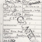The inside of Sidonia’s DP identification card, marked EMIGRATED Emigrated